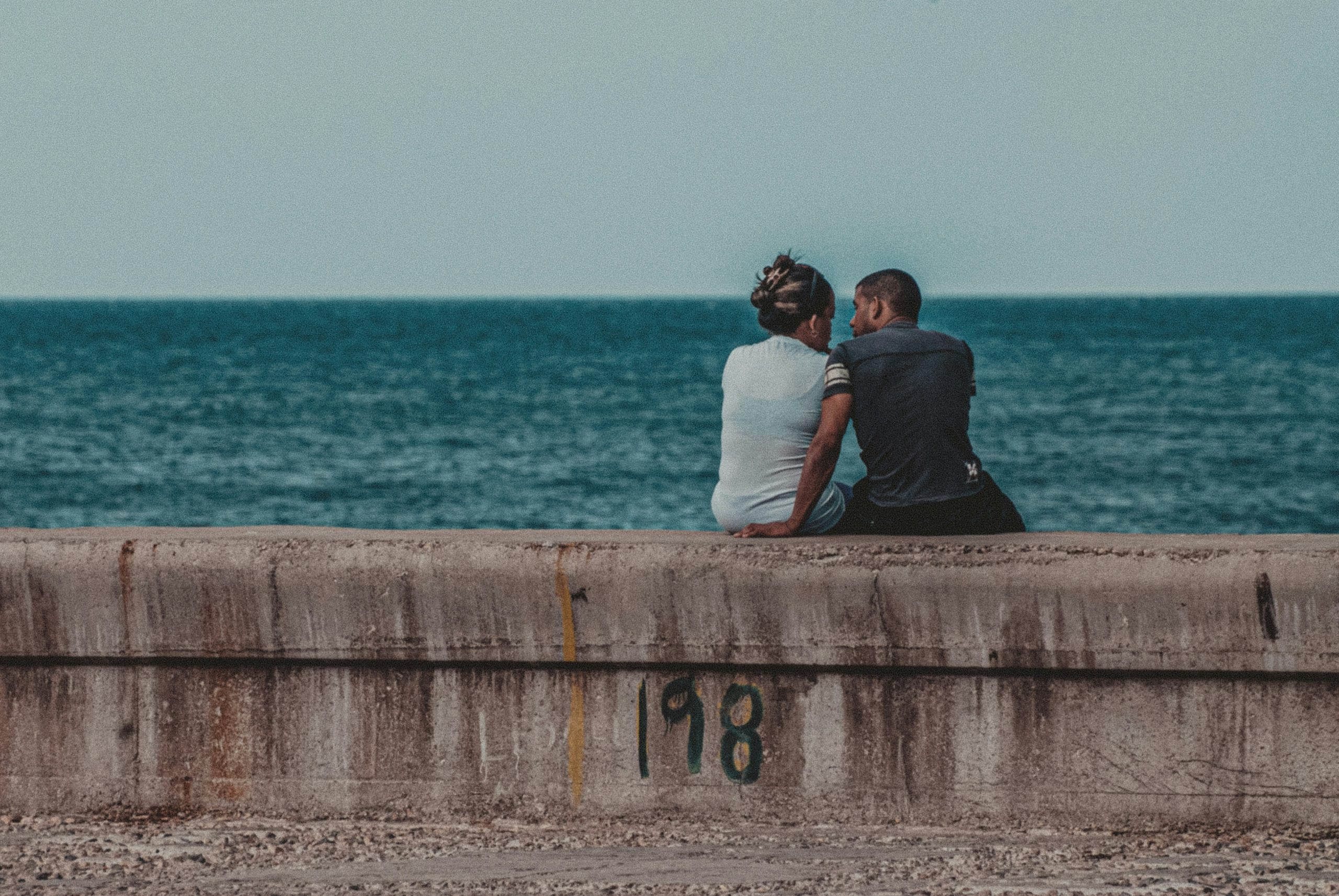 Couple on Malecon Wall